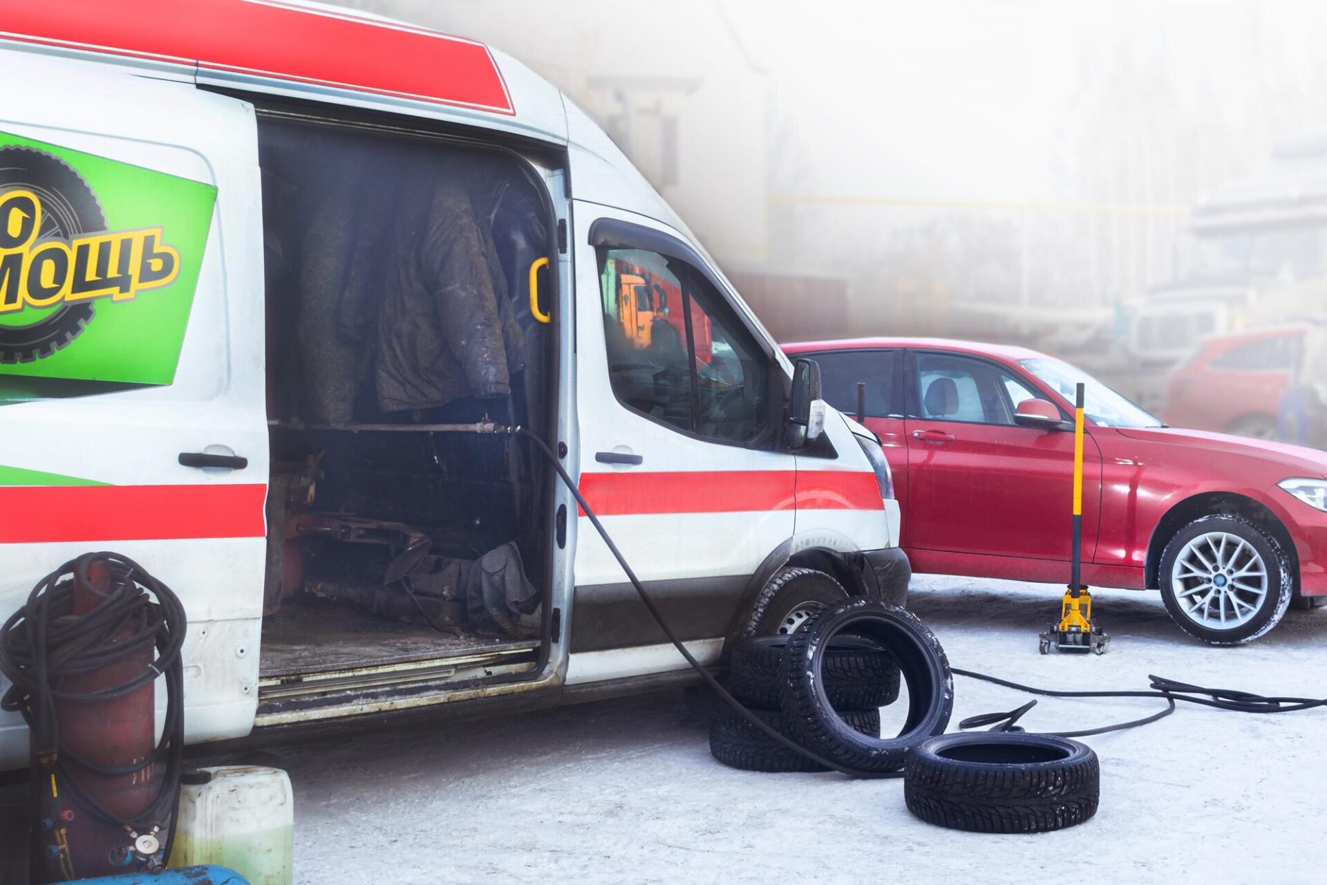 Onsite emergency tire fitting Emergency change tires on the car in winter on the street Mobile service
